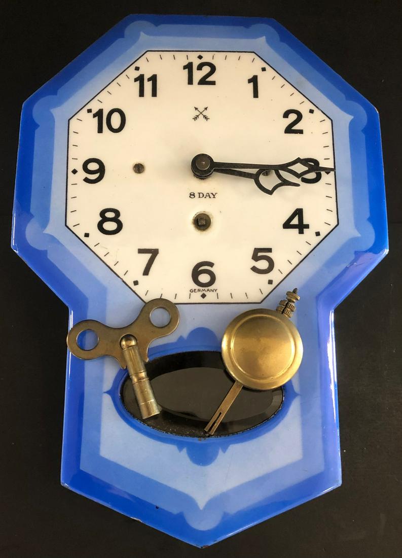 ART DECO BLUE & WHITE ENAMEL SCHOOL HOUSE WALL CLOCK: ART DECO BLUE AND WHITE ENAMEL SCHOOL HOUSE STYLE WALL CLOCK WITH BEVELED GLASS - BRASS PENDULUM AND KEY - 9 1/2" HIGH X 6 3/4" WIDE X 2 3/4" DEEP - GREAT CONDITION STRUCTURALLY - NOT TESTED
