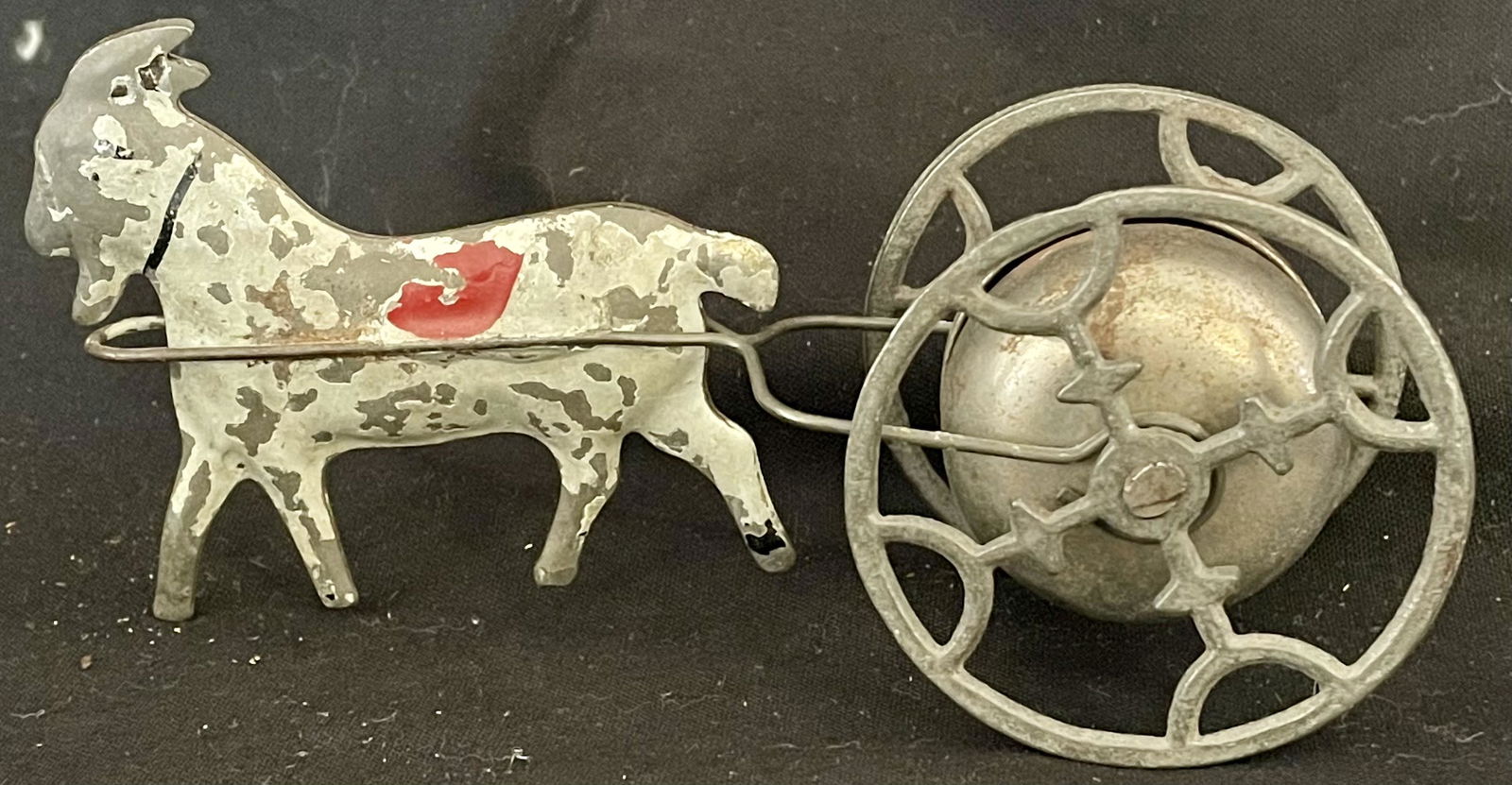 ANTIQUE TIN LITHO GOAT BELL TOY: ANTIQUE TIN LITHO GOAT BELL TOY - TIN GOAT IN ORIGINAL PAINT, CAST IRON WHEELS, BELL 'WORKING' - 5 1/4" X 1 3/4" WIDE X 2 1/2" HIGH