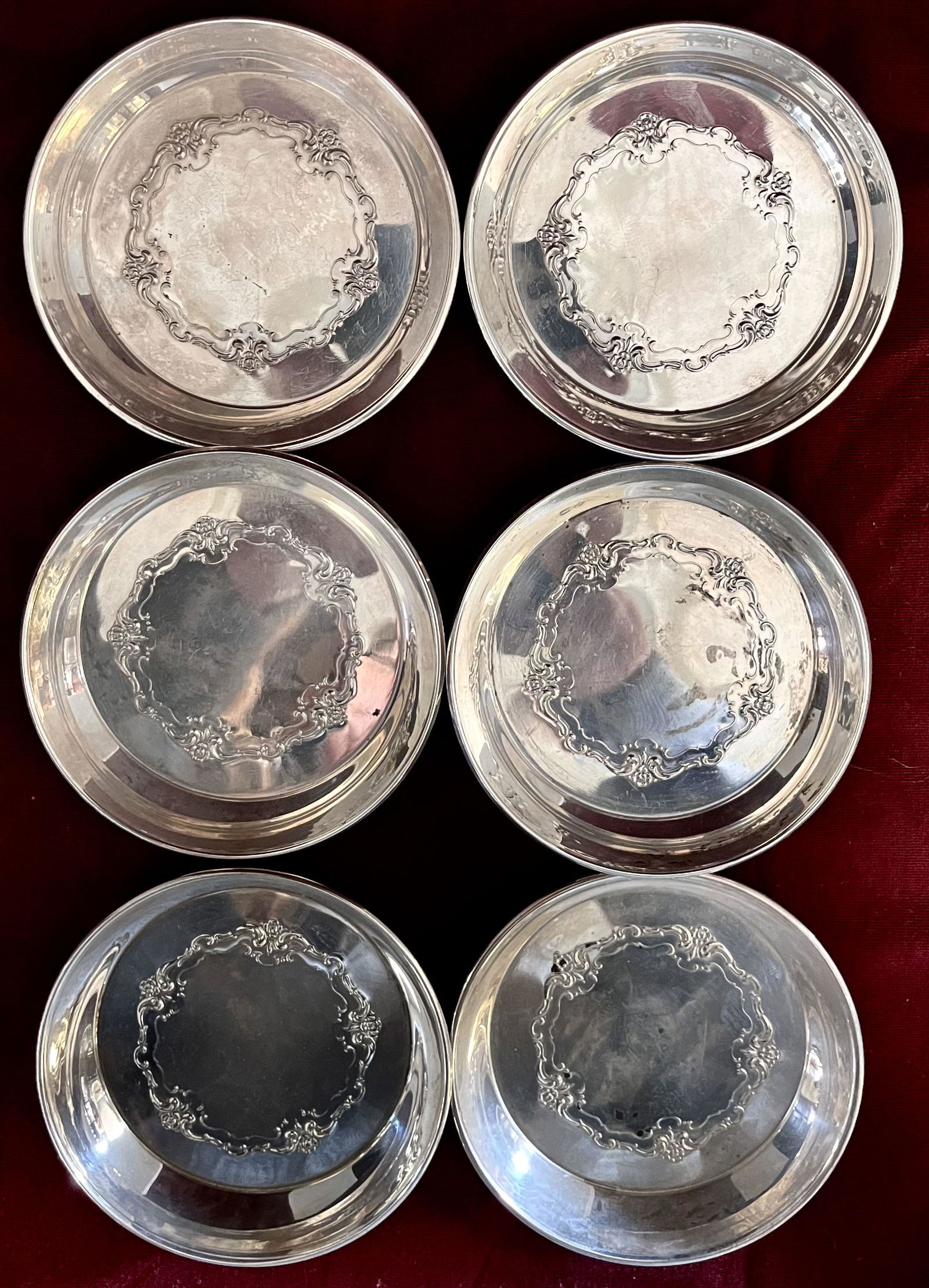 LOT 7 TOWLE STERLING SILVER COASTERS: LOT 7 TOWLE STERLING SILVER COASTERS - EMBOSSED DECORATION ON INTERIOR BOTTOMS - 3 5/8" DIAMETER - 1/2" HIGH - 8.55 TROY OZS