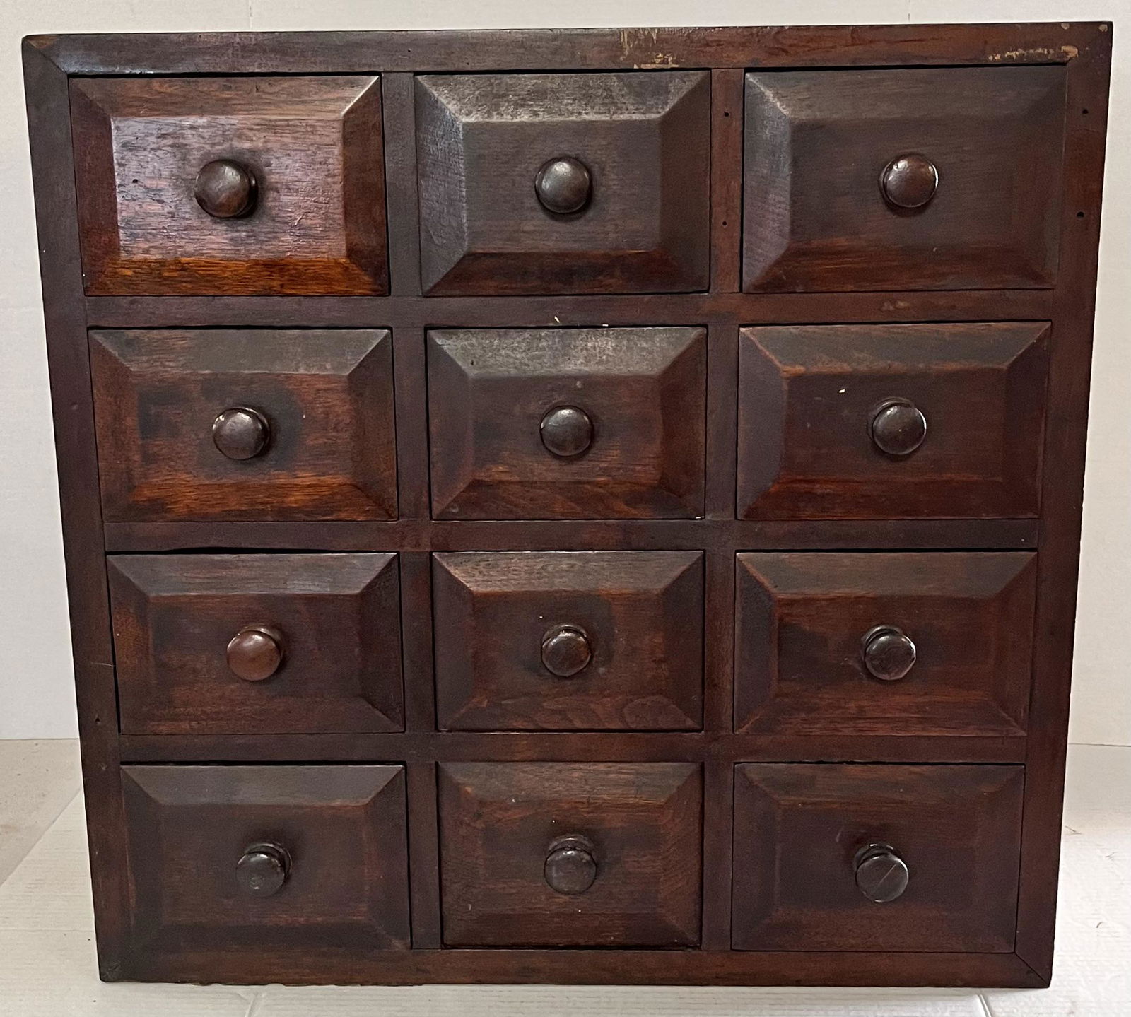 19TH C. 12 DRAWER TABLE TOP APOTHECARY CHEST: 19TH C. 12 DRAWER TABLE TOP APOTHECARY CHEST WITH CHAMFERED DRAWER SIDES - OLD PAINT ON SIDES AND TOP - HAND DOVETAILED CASE - GOOD OVERALL CONDITION - 24 5/8" WIDE X 9 1/2" DEEP X 23 3/4" HIGH