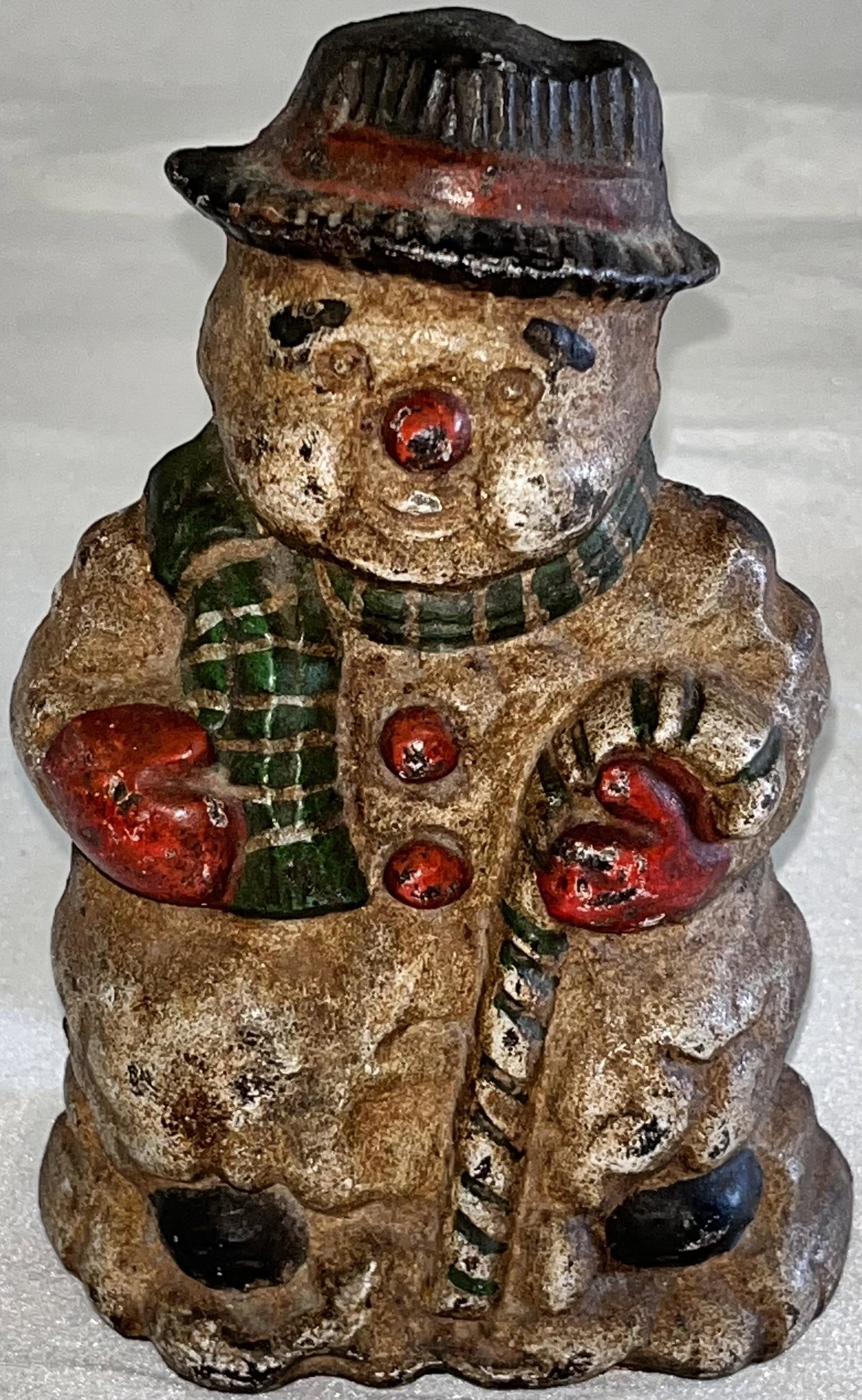 CAST IRON SNOWMAN DOORSTOP IN ORIGINAL PAINT: CAST IRON SNOWMAN DOORSTOP IN ORIGINAL PAINT - 6 7/8" HIGH, 4 1/2" WIDE, 3 1/4" DEEP
