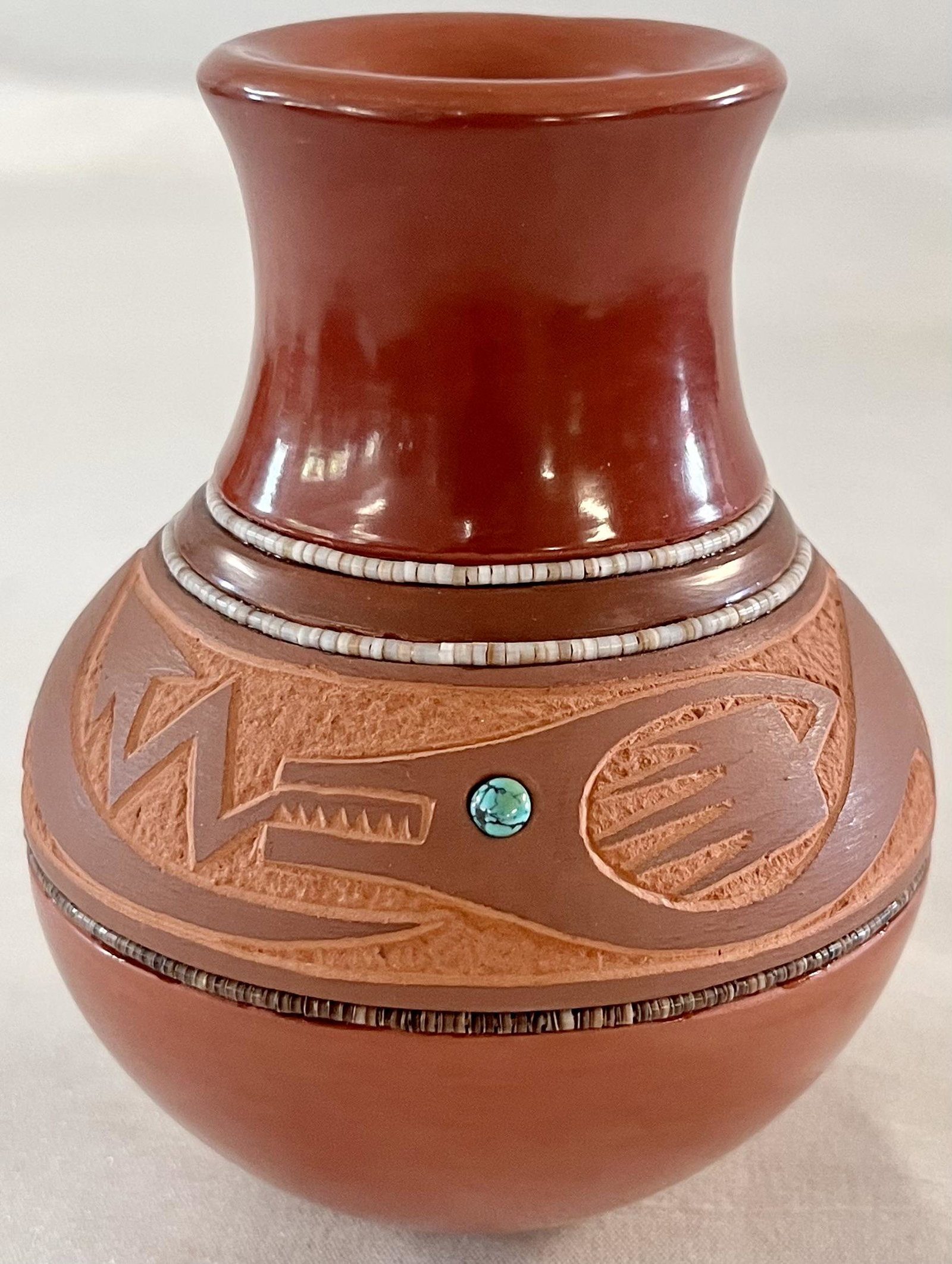 REDWARE JAR W/ INCISED AVANYU DECORATION & TURQUOISE INLAY: REDWARE JAR W/ INCISED AVANYU (PLUMED WATER SERPENT) DECORATION,TURQUOISE INLAY AND HEISHI - IN THE MANNER OF TONY DA - SIGNED (INCISED) ON THE BOTTOM WITH A PERSON IN A KAYAK (CAN'T IDENTIFY THE MARK
