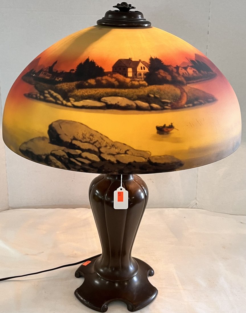 ART DECO BRONZED LAMP W/ REVERSE GLASS PAINTED SHADE: ART DECO BRONZED LAMP BASE WITH REVERSE GLASS PAINTED SHADE WITH LANDSCAPE / LAKE SCENE - ROCKY SHORE SEASCAPE WITH BOATS - 24" HIGH, 18" DIAMETER SHADE - GOOD OVERALL CONDITION