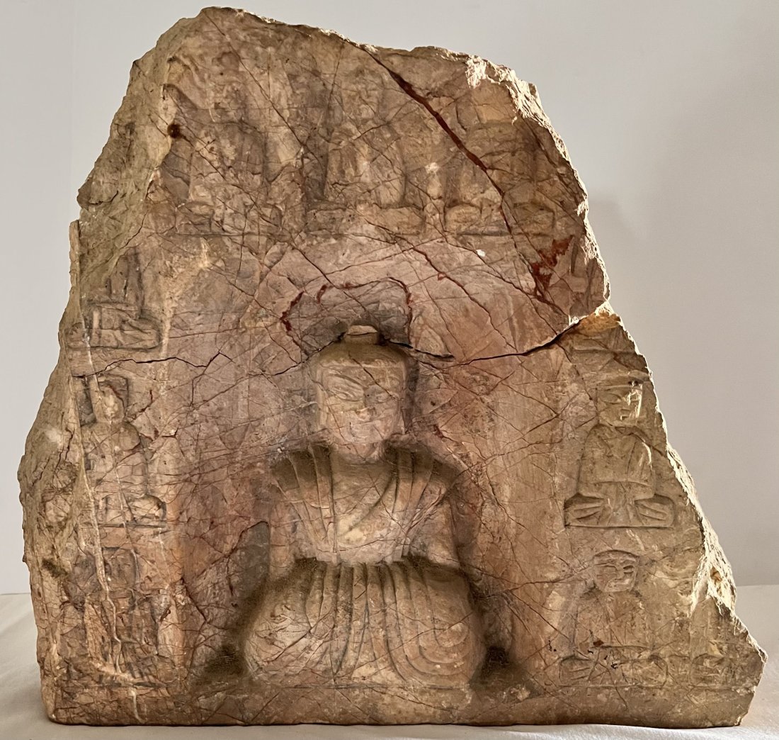 CARVED STONE WITH FIGURE OF BUDDHA: CARVED STONE WITH BUDDHA - LARGER CENTRAL SEATED BUDDHA FIGURE SURROUNDED BY OTHER CARVED FIGURES - STONE HAS BEEN REPAIRED - APPEARS THAT IT WAS BROKEN IN HALF AND REATTACHED - 15 1/4" WIDE X 4" DEEP