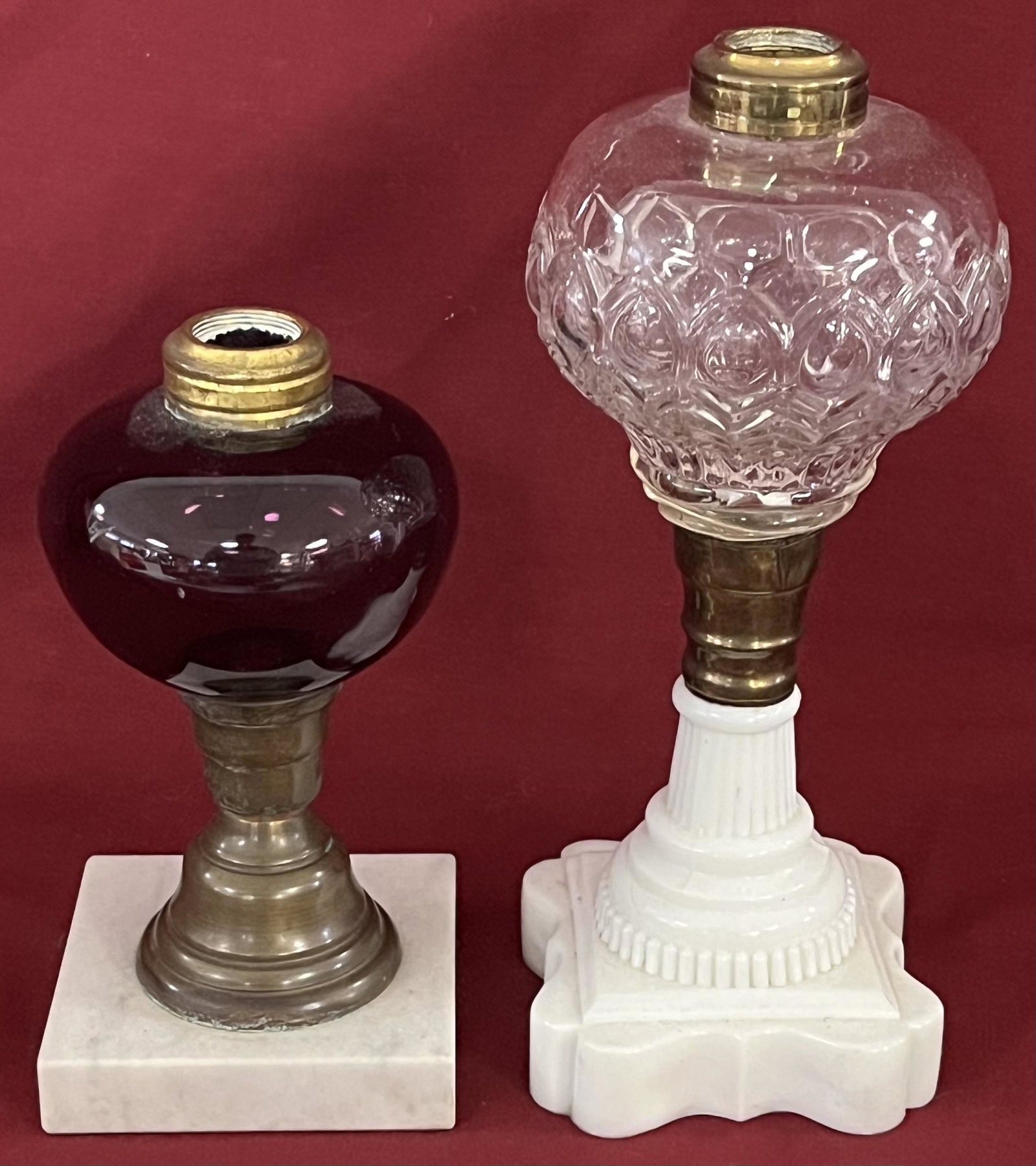 LOT 2 19TH C. WHALE OIL LAMPS: LOT 2 19TH C. WHALE OIL LAMPS - ONE WITH AMETHYST FONT AND MARBLE BASE 6 3/4" HIGH - ONE WITH CLEAR FONT AND MILK GLASS BASE 9" HIGH - BOTH IN GOOD CONDITION WITH NO CHIPS, CRACKS OR REPAIRS