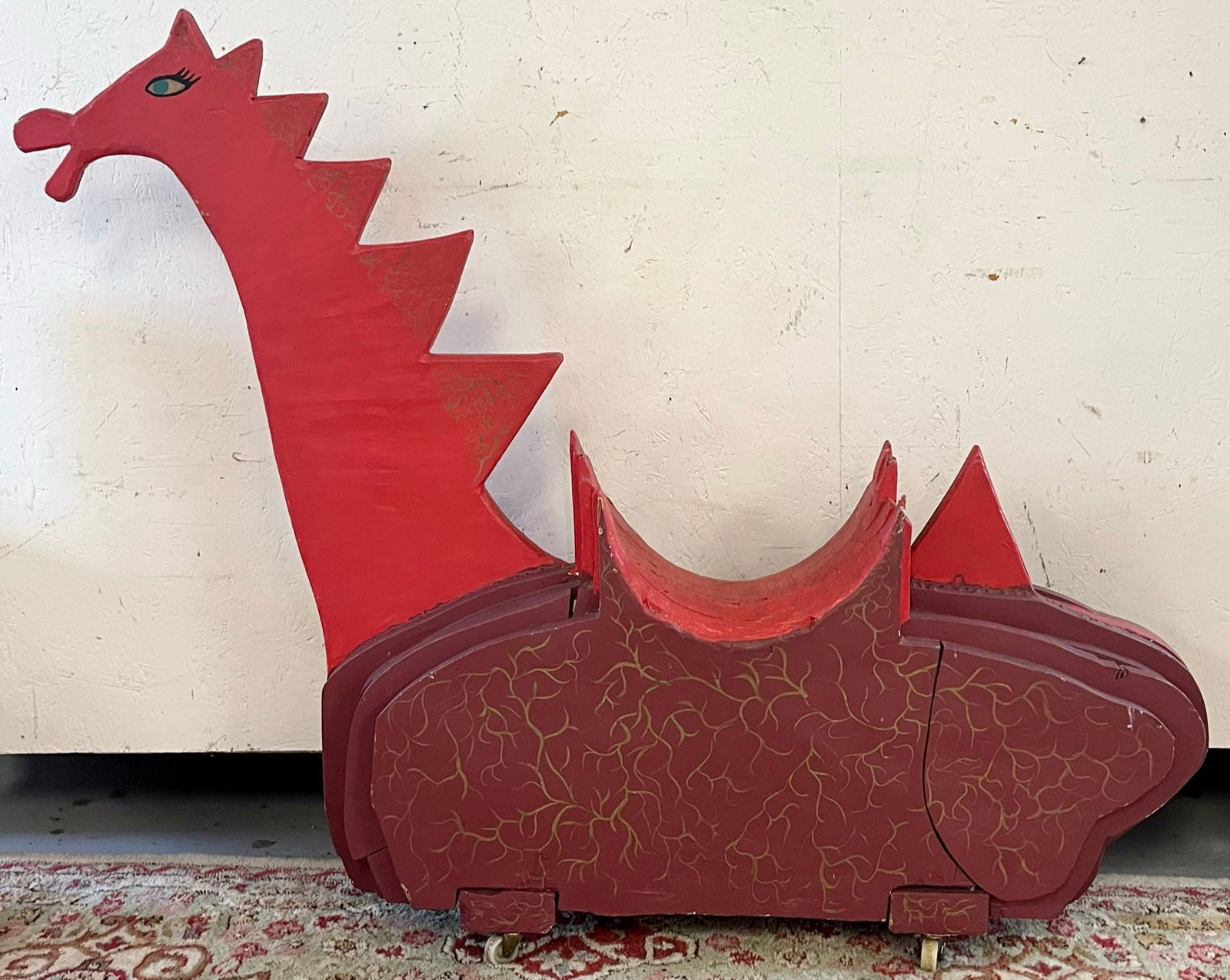 20TH C. WOODEN FOLKART DINOSAUR CHILDREN'S RIDE ON TOY: ONE OF A KIND 20TH C. WOODEN FOLKART DINOSAUR CHILDREN'S RIDE ON TOY ON WHEELS - PAINT DECORATED - GOOD OVERALL CONDITION - PLEASE VIEW ALL PHOTOS FOR DETAILS AND CONDITION
