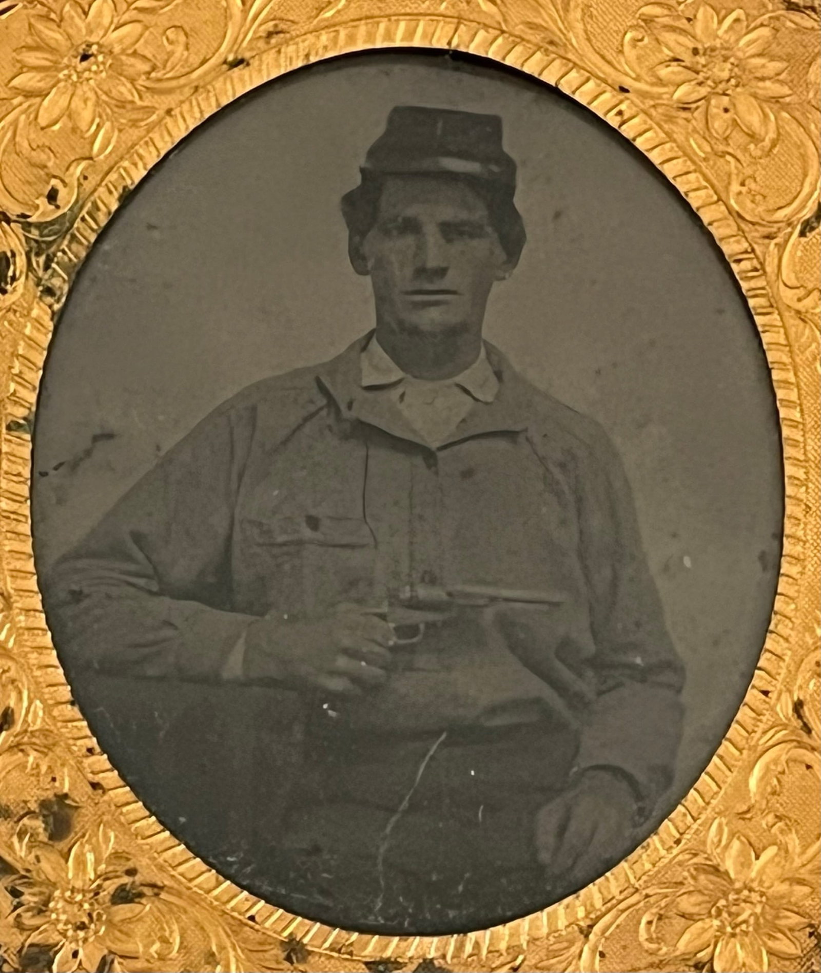 CIVIL WAR ERA DAGUERROTYPE OF SOLDIER, IDENTIFIED: CIVIL WAR ERA DAGUERROTYPE OF SOLDIER, IDENTIFIED AS Hiram Van Buren. Rest of description says "Rosendah(?) 1 no 3 From Hair taken Black coat also " ." Photo of man in uniform holding a pistol - PLEAS
