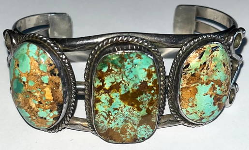 NATIVE AMERICAN STERLING & TURQUOISE CUFF BRACELET: NATIVE AMERICAN STERLING & TURQUOISE CUFF BRACELET - 3 LARGE NATURAL TURQUOISE CABOCHON STONES - LARGEST CENTER STONE MEASURES 1 1/8" X 11/18" - ARTIST SIGNED ON INTERIOR - 6" INTERIOR MEASUREMENT - 7