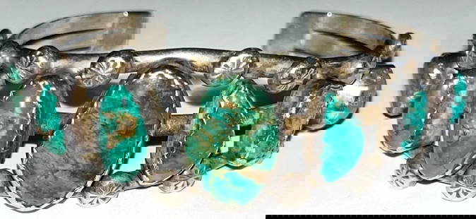 NATIVE AMERICAN STERLING & TURQUOISE CUFF BRACELET: NATIVE AMERICAN STERLING & TURQUOISE CUFF BRACELET - 7 GRADUATED SIZE NATURAL TURQUOISE STONES - 3/4" X 1/2" LARGEST CENTER STONE - STAMPED "STERLING" AND STAMPED MAKERS MARK "BB" - 40.21 TOTAL GRAMS