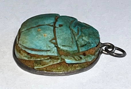 CARVED EGYPTIAN FAIENCE SCARAB PENDANT MOUNTED IN SILVER: CARVED EGYPTIAN FAIENCE SCARAB PENDANT MOUNTED IN SILVER WITH CARVED SYMBOLS ON BOTTOM