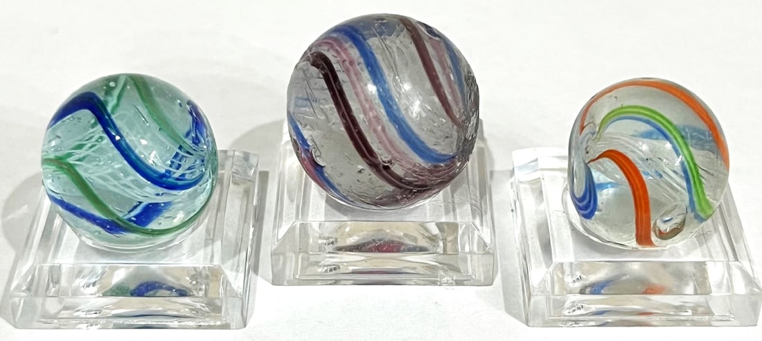 3 ANTIQUE GERMAN SWIRL LATTICINIO CORE MARBLES: 3 ANTIQUE GERMAN SWIRL WHITE LATTICINIO CORE MARBLES WITH VARIOUS COLOR SWIRLS - PLEASE VIEW PHOTOS PROVIDED