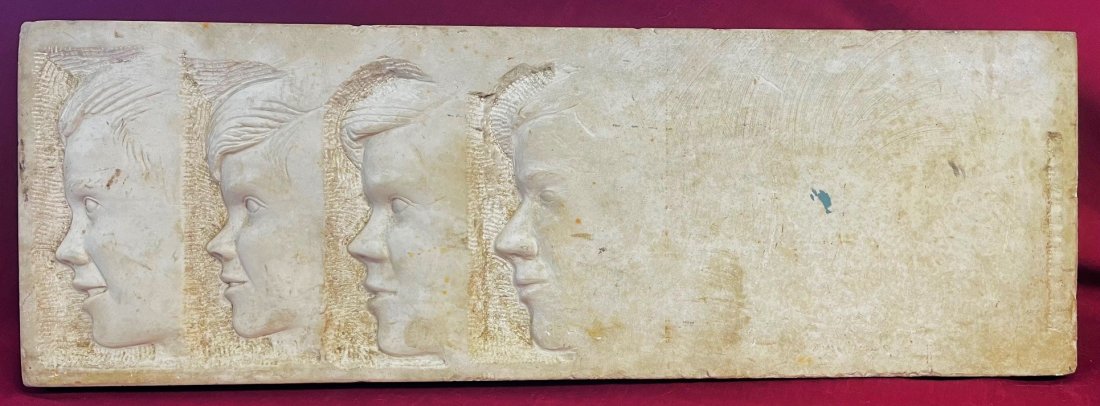MARBLE SCULPTURE / CARVING AGE TRANSITION PROFILES ROBERT F. KENNEDY: MARBLE SCULPTURE / CARVING SHOWING 4 AGE PROGRESSION PROFILE CARVINGS OF PRESIDENT ROBERT F. KENNEDY, STARTING AT A YOUNG AGE - CARVED ON A WHITE MARBLE PLAQUE - GOOD OVERALL CONDITION - MEASURES APPR