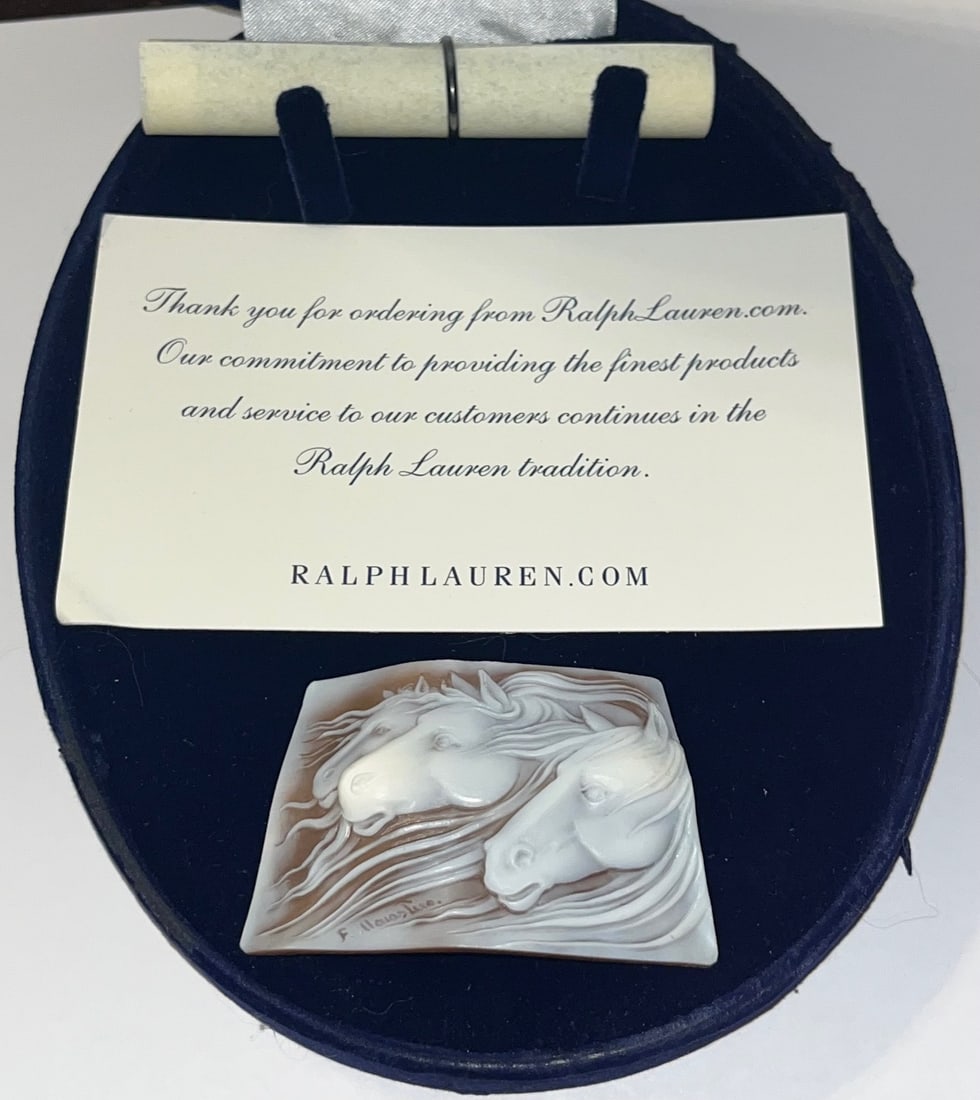 ARTIST SIGNED CARVED / ENGRAVED CAMEO OF HORSES BY FRANCO MONASTERO: ARTIST SIGNED CARVED / ENGRAVED CAMEO OF HORSES BY FRANCO MONASTERO AND SOLD BY RALPH LAUREN - COMES IN BLUE VELVET CASE AND CERTIFICATE OF AUTHENTICITY - MEASURES 2 5/8" WIDE X 1 3/4" HIGH - EXCELLEN