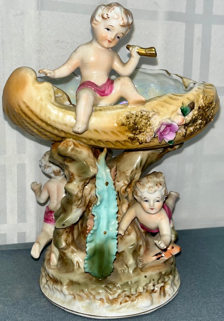 HAND PAINTED PORCELAIN COMPOTE WITH CHERUBS, FLOWERS, ETC.: HAND PAINTED PORCELAIN COMPOTE WITH CHERUBS, FLOWERS, ETC., MEASURES APPROX. 9" HIGH, 6 1/4" WIDE, GOOD OVERALL CONDITION, NO CHIPS, CRACKS, OR REPAIRS, CONDITION AS SEEN IN PHOTOS PROVIDED