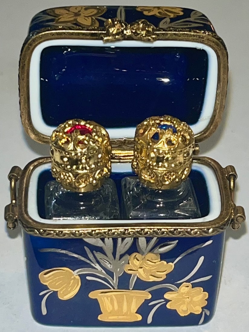 Limoges France Hand-Painted Perfume Casket with Gilt Crown Bottles, Limited Edition #83/1000: A stunning collectible Limoges porcelain perfume box, exquisitely hand-painted in cobalt blue with gilt floral detailing and adorned with ornate bronze trim and clasp. This hinged trinket box opens to