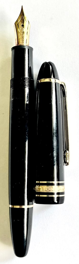 Montblanc Meisterst, ck No. 146 Fountain Pen with 18K Gold Nib: ck No. 146 fountain pen featuring a smooth black resin body and gold-plated trim, capped with the signature white snowcap emblem. Fitted with a two-tone 18K gold nib (marked 750), this piston-fill pen
