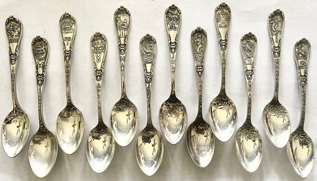 Set of 12 Sterling Silver Zodiac spoons with embossed month, Zodiac symbol & floral dec. 134.24g: Set of 12 Sterling Silver Zodiac demitasse spoons with embossed month, Zodiac symbol & floral decoration, All embossed on reverse with "Sterling", "Mar. 20, '94 and maker's marks, total weight 134.24 