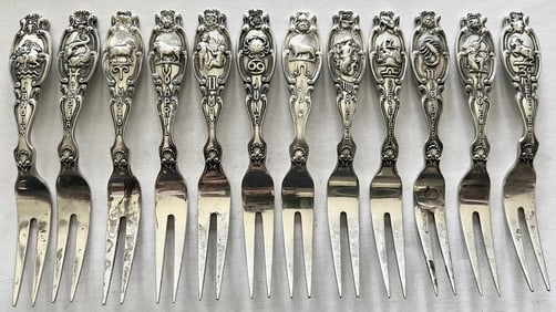 Set of 12 Sterling Silver Zodiac cocktail forks with embossed month, Zodiac symbol & flower, 157.31g
