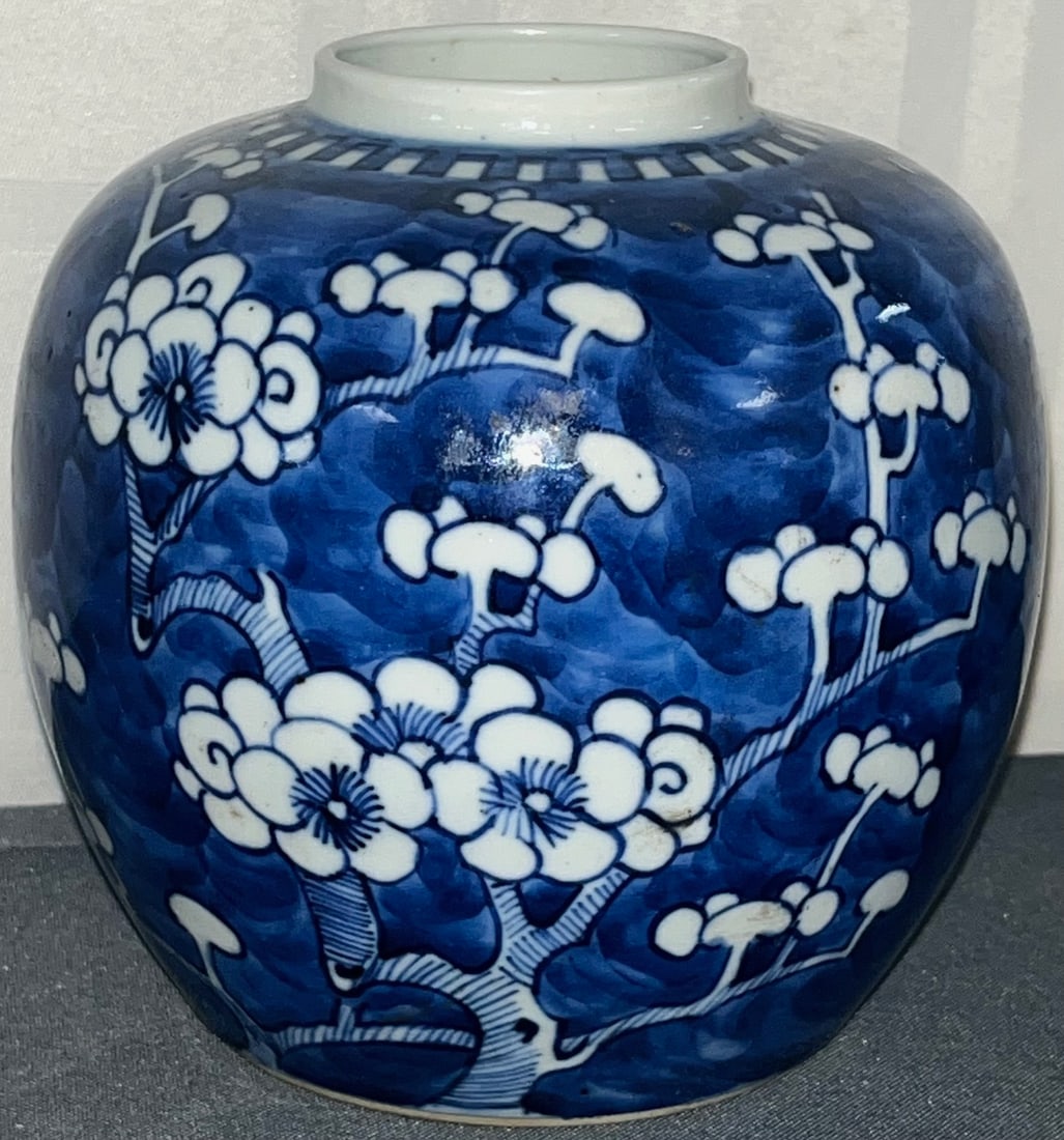 Chinese Blue & White Porcelain Ginger Jar with Prunus Blossom Motif, Qing Dynasty: A finely hand painted Chinese Blue & White Porcelain Ginger Jar featuring classic Prunus Blossoms in underglaze blue. The piece reflects Kangxi-style popular during the late Qing Dynasty. Marked with 