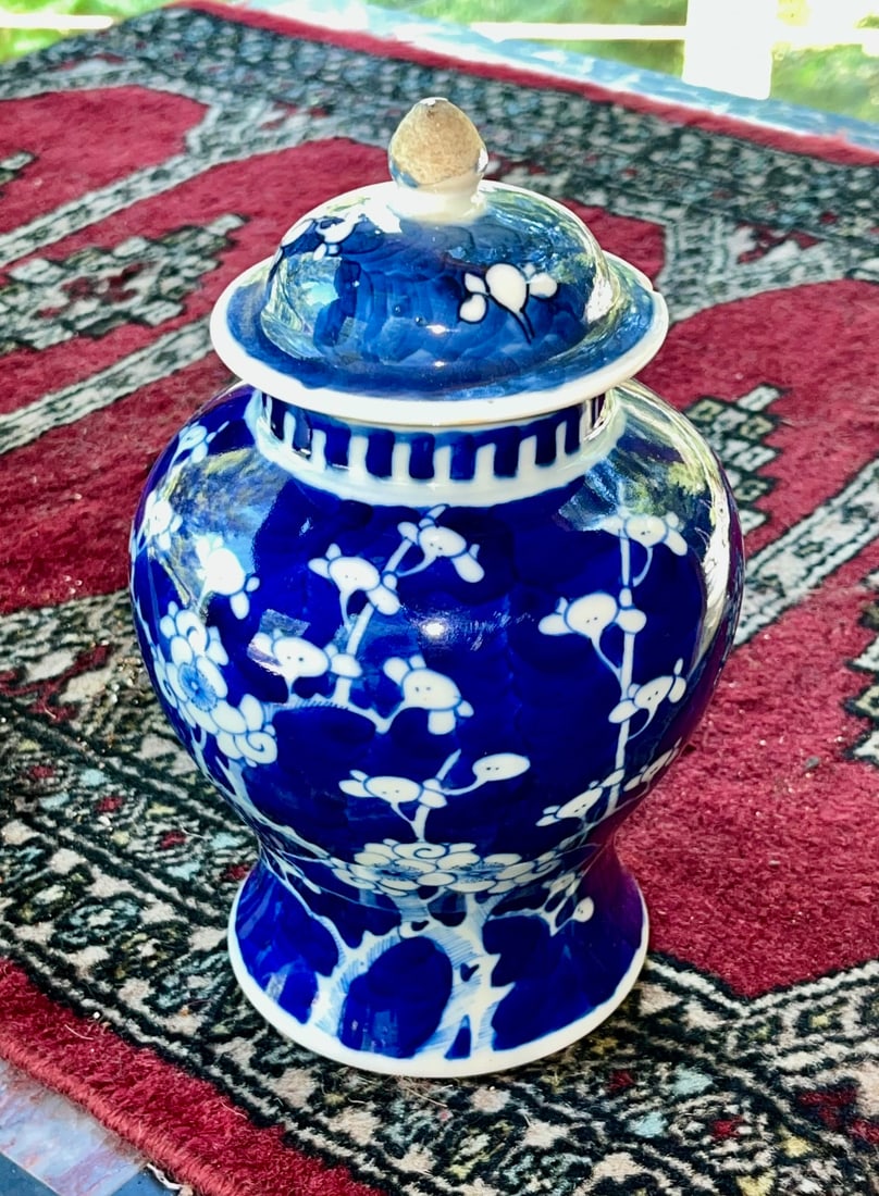 Chinese Blue & White Porcelain Ginger Jar with lid, Prunus Blossom Motif, Qing Dynasty: A Chinese porcelain ginger jar with domed lid, decorated in underglaze blue with white prunus blossoms on a deep cobalt ground. Likely from the late Qing Dynasty. Marked with a double blue ring on the