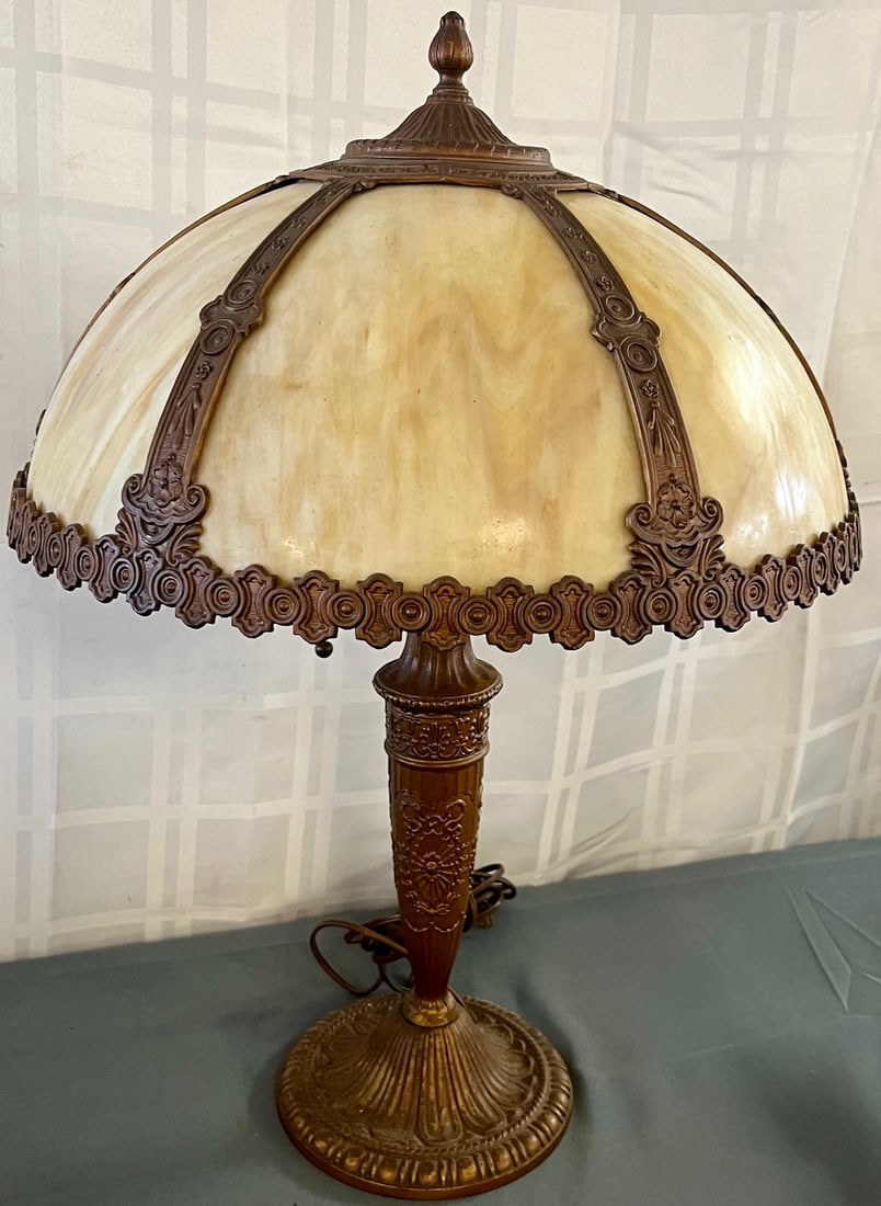 Antique Bent Panel Multi-Color Slag Glass Parlor Lamp by "Sale M Bros.": Antique Bent Panel Multi-Color Slag Glass Parlor Lamp with elaborate embossed metal work and base, Base marked with a Sail Boat Logo and "SALE M BROS." (Salem Brothers Co. from New York), measures app