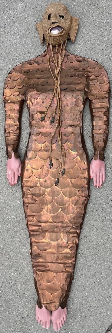 Artist Signed Life-Size Mermaid Copper Scale Mixed Media Sculpture, Hena Martens 1975: A large scale mixed media figure, signed on the reverse Hena Martens '75, hand crafted in 1975 featuring painted plaster face and limbs, copper scale body on a wooden back board where it is signed and