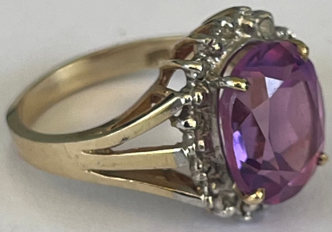 10K Yellow Gold, Diamond, Amethyst Ring, Stamped 14K, Size 7, 4.82 grams: 10K Yellow Gold, Diamond, Amethyst Ring with a large faceted center Amethyst surrounded by round-cut diamonds set in yellow 14K gold, Stamped 14K and tested, Size 7, 4.82 grams all inclusive