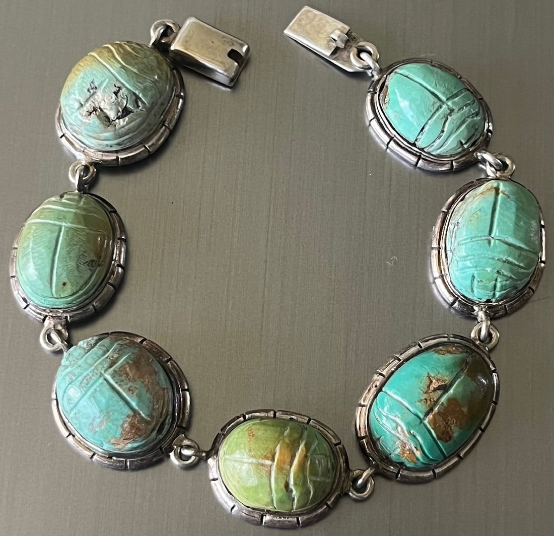 Egyptian Revival Scarab Bracelet, Silver and Natural stone: Egyptian Revival Scarab Bracelet, Silver and Natural stone, featuring 7 bezel-set carved scarabs, possibly Turquoise, Serpentine or Egyptian Faience, set in sterling silver, marked .925, the back of t