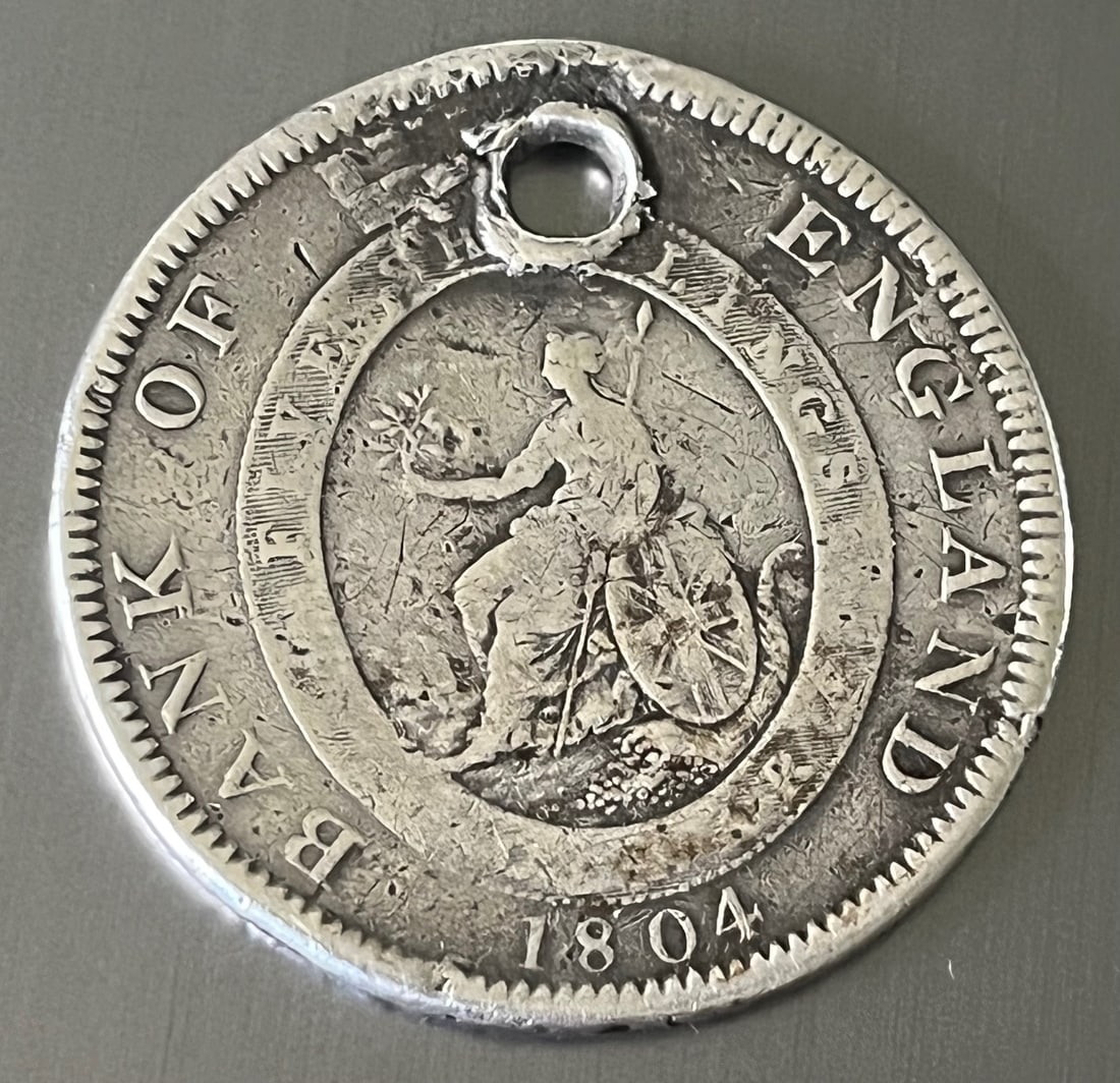 1804 Bank of England Silver Dollar, King George III: 1804 Bank of England Silver Dollar, King George III, An original 1804 Bank of England silver dollar featuring the bust of King George III and Britannia seated with shield spear and olive branch, known