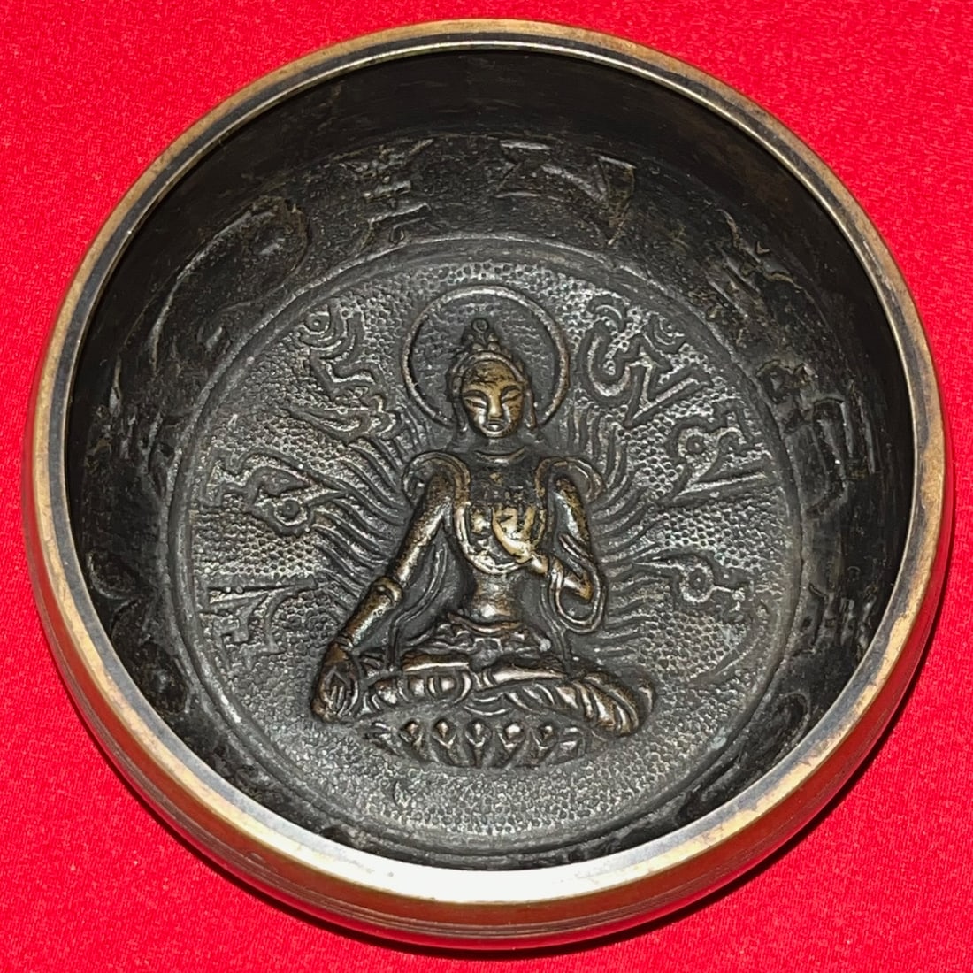 Vintage Tibetan Singing Bowl w/ Buddha Relief & Om Mani Padme Hum Mantra: Vintage Tibetan Singing Bowl with Buddha Relief & Om Mani Padme Hum Mantra, A beautifully crafted Tibetan bowl featuring a detailed relief of Avalokiteshvara (Bodhisattva of Compassion) seated in medi