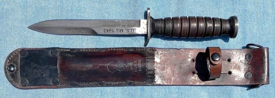 WWII U.S. M3 Trench Knife (1943) With Original Leather M6 Sheath: WWII U.S. M3 Trench Knife (1943) With Original Leather M6 Sheath, A nice example of an original U.S. M3 World War One Trench Knife dated 1943. A combat knife issued to American troops during WWII, Bla