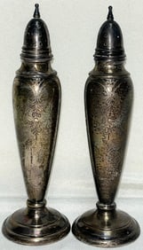 Pr. 6 3/4" solid (not weighted) sterling silver salt and pepper shakers, 134.87 grams