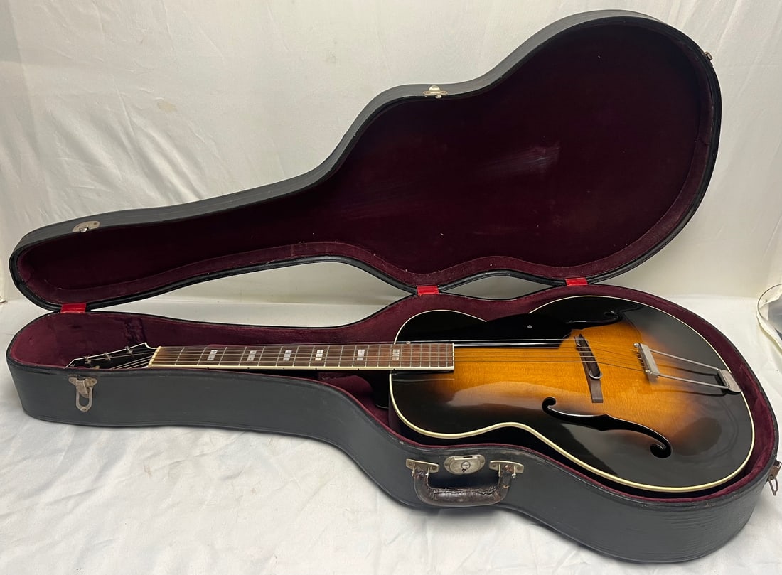 c. 1947–48 Epiphone Spartan New York Masterbilt Archtop Guitar, Serial #57606, Sunburst, With Case: Epiphone Spartan archtop acoustic guitar, New York City production, c. 1947–1948, serial no. 57606. The Spartan was Epiphone’s professional-grade Masterbilt archtop model of the era, featuring a c