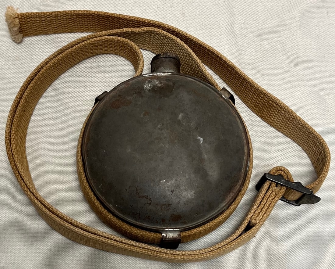Miniature Tin Pancake Canteen, Cotton Strap, Wood Stopper, Child / Youth Outdoor Gear (c.: Miniature Tin Pancake Canteen, Cotton Strap, Wood Stopper, Child / Youth Outdoor Gear (c. 1900–1930), Unusual miniature round tin/steel “pancake” canteen measuring approx. 4 inches in diamet