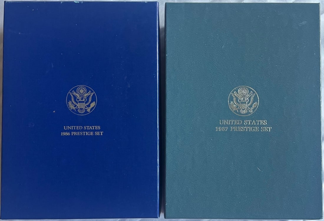 1986, 1987 U.S. Mint Prestige Proof Sets, 1986 Statue of Liberty / Ellis Island, 1987 U.S.: This lot contains Two (2) Prestige Proof Sets Including A 1986-S U.S. Mint Prestige Proof Set (7 COIN SET) – Statue of Liberty Centennial w/ Silver Dollar & Half, OGP/COA, Complete 1986 United State