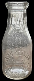 Original early 20th-century embossed milk bottle from John Beam, Adams, Massachusetts. This one-pint