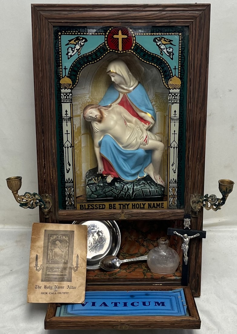 1909 Koenig Bros. “Holy Name Altar” Sick Call Outfit with Pietà Shrine, Viaticum Case &: 1909 Koenig Bros. “Holy Name Altar” Sick Call Outfit with Pietà Shrine, Viaticum Case & Original ContentsAn exceptionally complete and evocative early 20th-century Catholic Sick Call altar, k