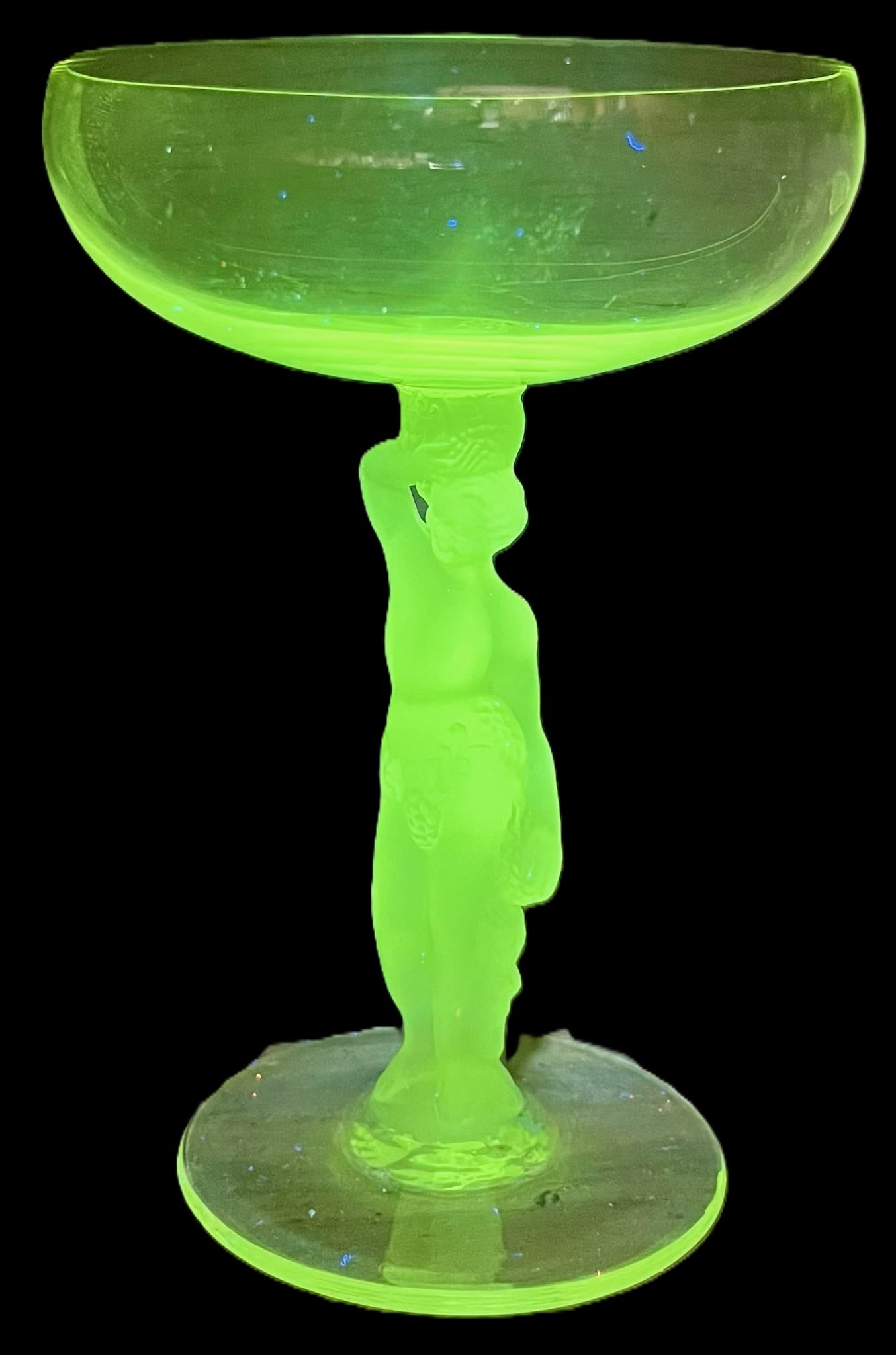 Exceptional Set of Four Art Deco Nude Figural Champagne Coupes – Uranium Vaseline Glass Stems, c.: Rare and visually striking set of four matching Art Deco champagne coupes, each featuring a sculptural nude figural stem supporting a shallow coupe bowl. The stems, bases and "bowls" are made of urani