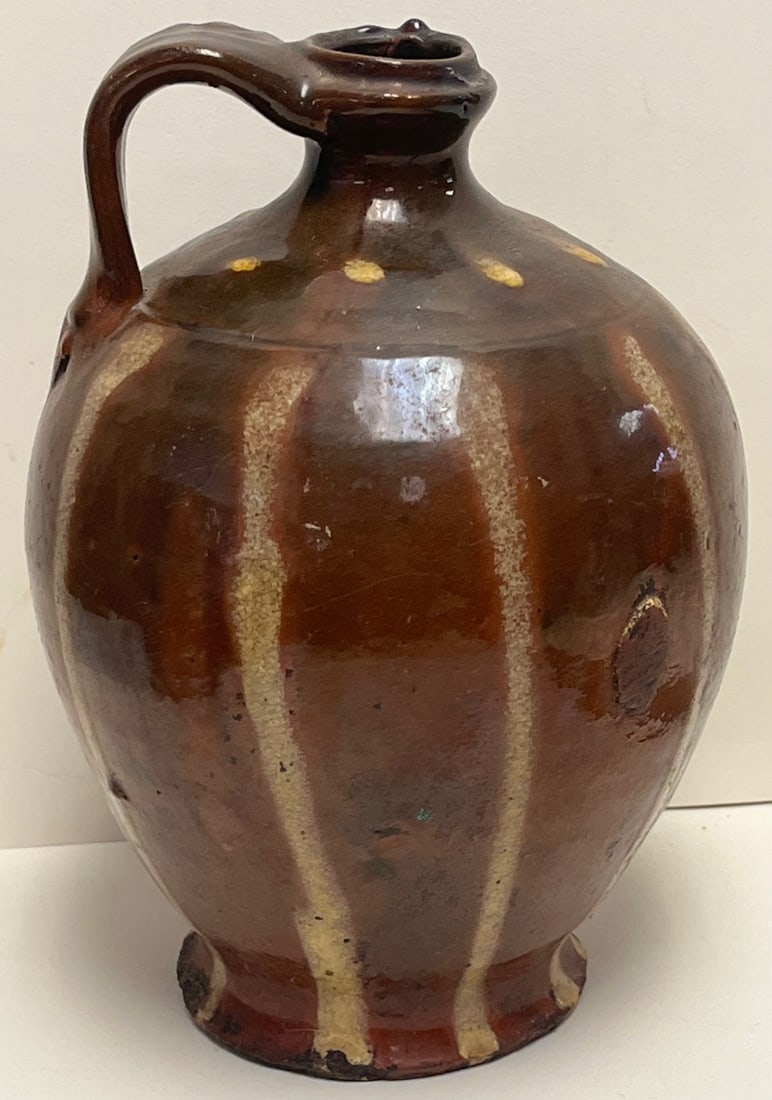 19TH C. Ovoid Form Slip Decorated Redware Jug, Vertical Yellow Slip Stripes and Dots: 19TH C. Ovoid Form Slip Decorated Redware Jug decorated with Vertical Yellow Slip Stripes and Dots, MEASURES APPROX. 8 1/2" HIGH, 5 1/2" IN DIAMETER, thrown in a rounded ovoid form with a tooled colla