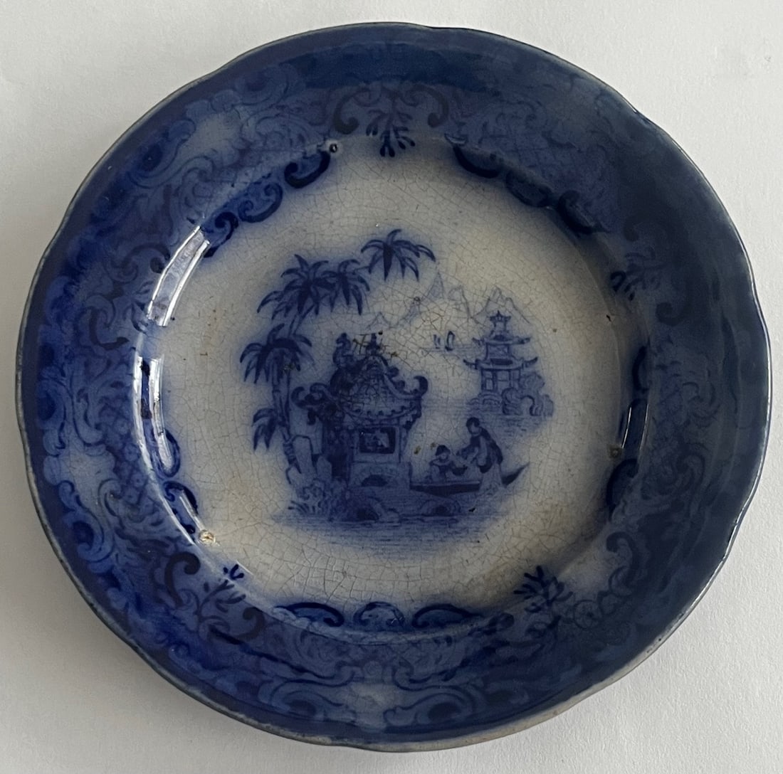 Early 19th Century English Blue Transferware / Flow Blue Butter Pat with Chinese Pagoda Scene: Early 19th Century English Blue Transferware / Flow Blue Butter Pat with Chinese Pagoda Scene, MEASURES APPROX. 4" IN DIAMETER, Early 19th-century English blue transferware butter pat, decorated with