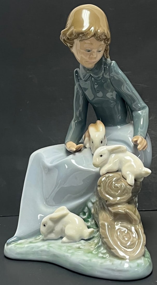 Lladro NAO Porcelain Figurine Girl with Rabbits #1407 – Handmade Spain 1987: Lladro NAO Porcelain Figurine Girl with Rabbits #1407 – Handmade Spain 1987, Charming vintage NAO by Lladro porcelain figurine featuring a young girl seated on a log interacting with three rabbi