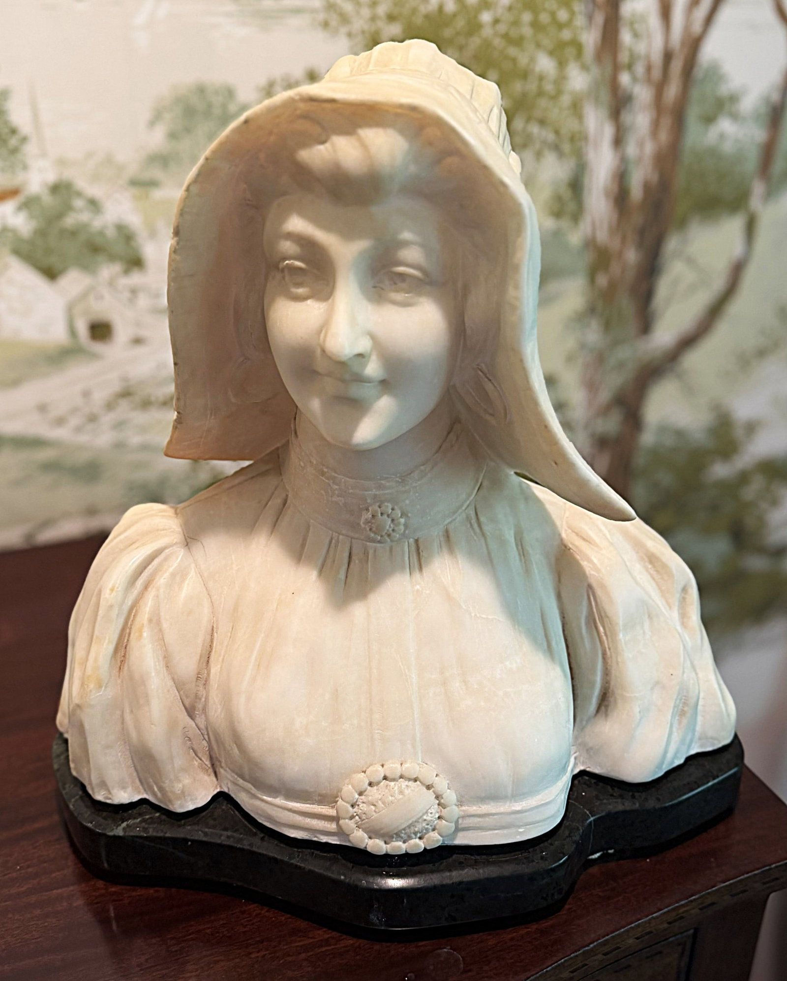 Signed A. Cipriani Italian Carved Alabaster Bust of Woman in Bonnet, c. 1900: A. Cipriani (Italian, active late 19th/early 20th century), finely carved alabaster portrait bust of a young woman wearing an elaborate traditional bonnet or headdress, circa 1890-1920.The sitter is m