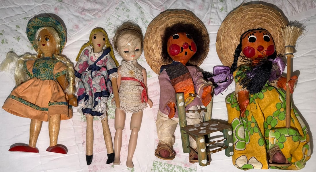 Vintage Folk Art & Mexican Souvenir Doll Collection, 7 Pieces: Collection of seven vintage dolls and folk-art figures of assorted construction and origin, likely mid-20th century. The group includes several colorful Mexican tourist/souvenir figures wearing woven 