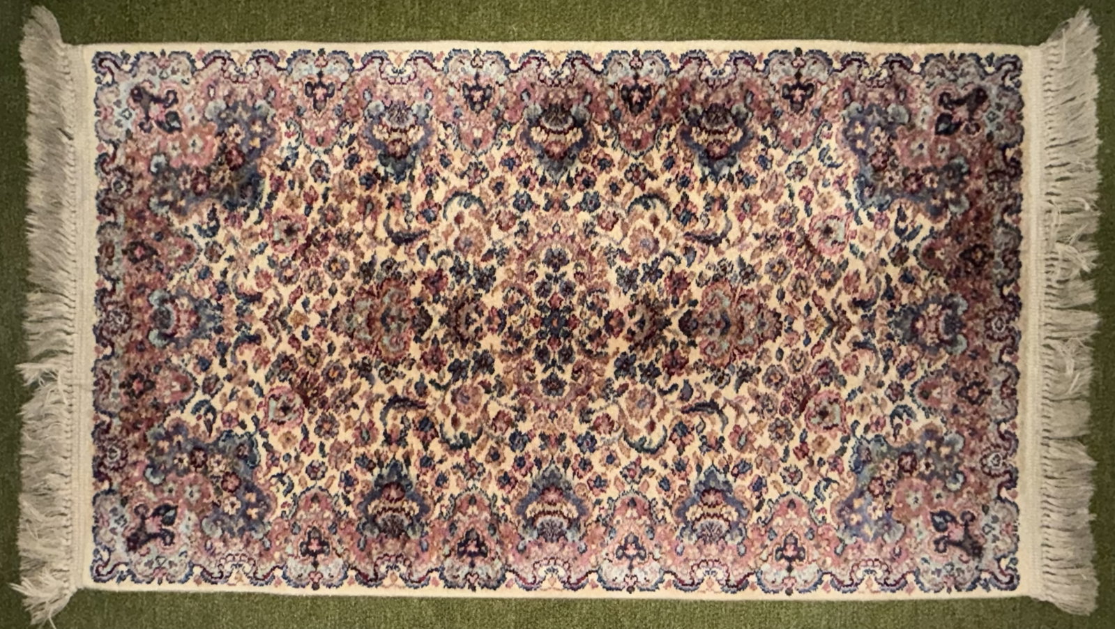 Persian Style Kerman Floral Area Rug, Cream Ground: Decorative Persian-style area rug featuring a dense allover floral and scrolling vine design on a warm ivory/cream field. The pattern is rendered in muted rose, burgundy, dusty blue, teal, navy and be