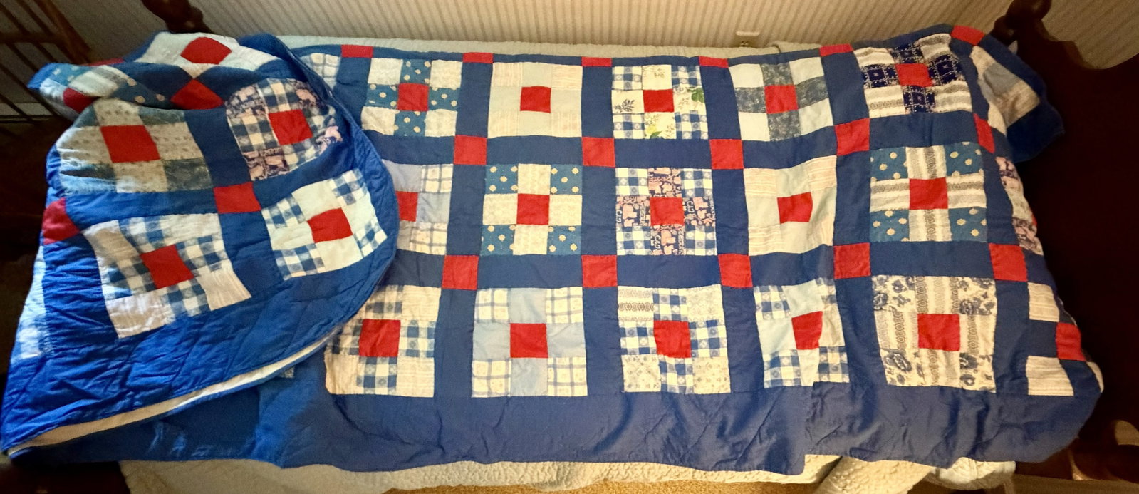 Vintage Hand-Pieced Red, White & Blue Patchwork Quilt, Folk Art: Vintage American hand-pieced patchwork quilt featuring a strong patriotic red, white and blue palette. Constructed in a repeating block pattern with bright red center squares surrounded by assorted bl
