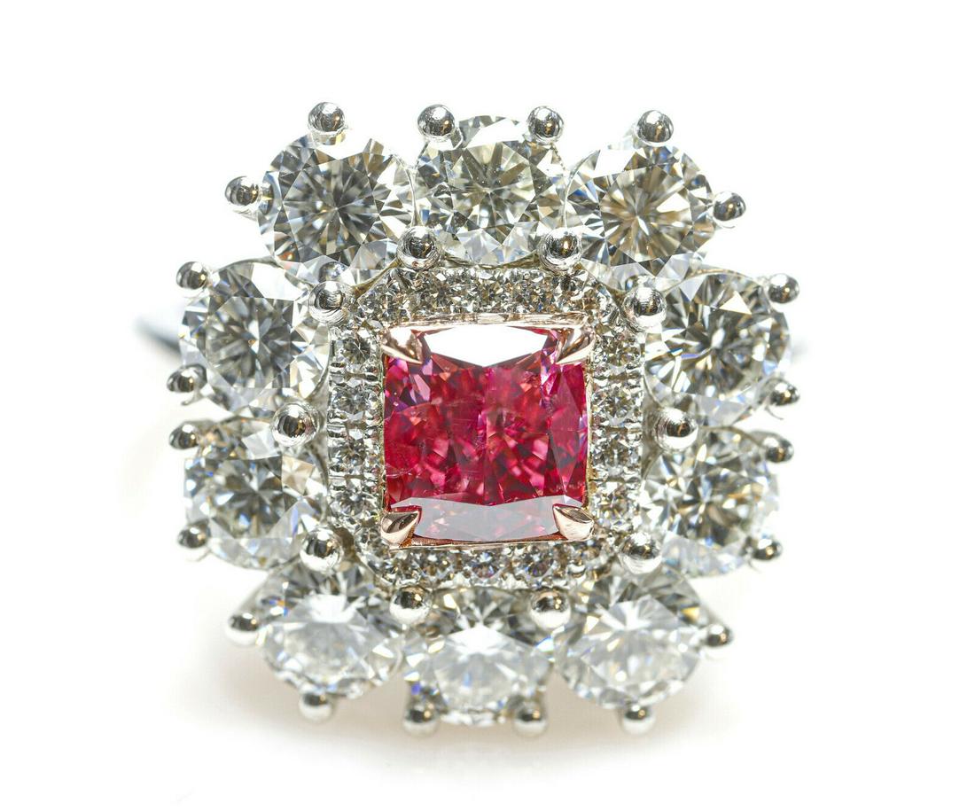 GIA 3.62ct Natural Argyle 1pp Fancy Vivid Pink Diamonds Platinum Engagement Ring: Certificate Number - GIA 2201481915Shape - Cushion, RoundsCarat Weight - Center 0.90ct, Sides 2.72ctMeasurements - 5.57x5.25x3.61, Rounds 4.00mmColor - 1PP Fancy Vivid Purplish Pink, D-EClarity - VS1-