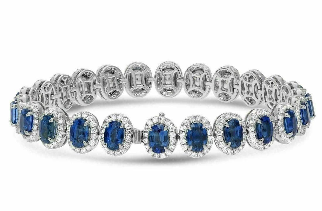 18.87CT DIAMOND & AAA SAPPHIRE 18KT WHITE GOLD 3D HALO TENNIS BRACELET: ESTATE 18KT WHITE GOLD TENNIS BRACELET. 3D CLASSIC HALO DESIGN. DIAMONDS ARE F/G COLOR, VSSI CLARITY 2.89 CARATS. AAA SAPPHIRE ARE 15.89 CARATS. MEASURES 9MM WIDE. 6.50 " INCHES LONG. WRITTEN APPRAISA