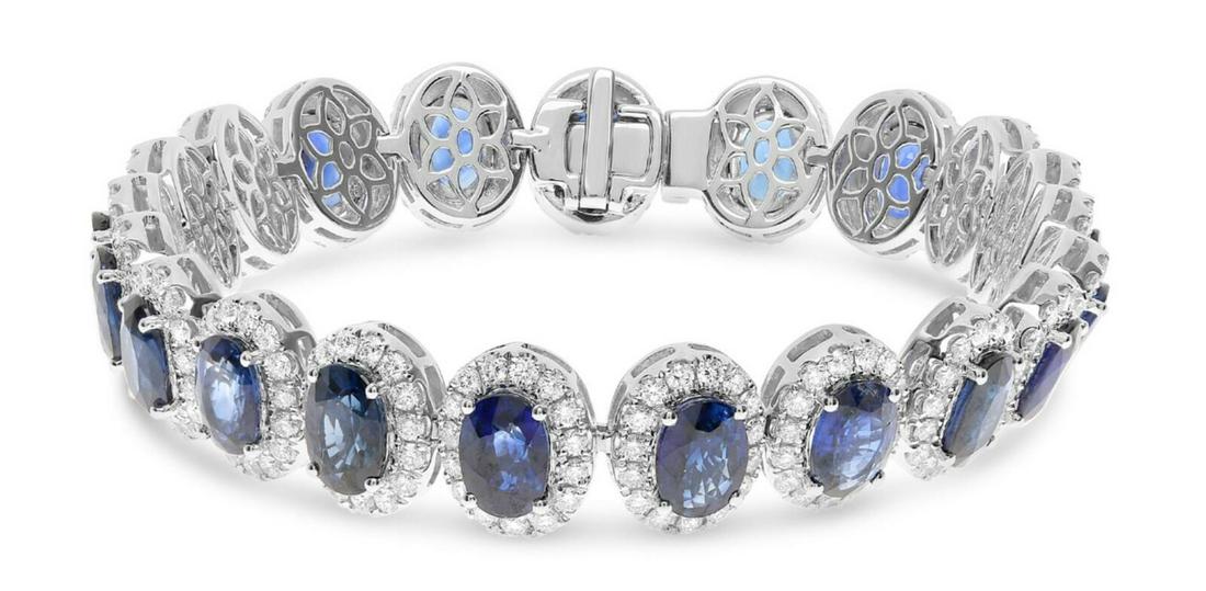 23.29CT DIAMOND & AAA SAPPHIRE 18K WHITE GOLD OVAL &ROUND FLOWER TENNIS BRACELET: 18KT WHITE GOLD TENNIS BRACELET. 3D MULTI FLOWER DESIGN. ROUND DIAMONDS ARE F/G COLOR, VSSI CLARITY 4.16 CARATS. AAA OVAL SAPPHIRES ARE 19.31 CARATS. MEASURES 10MM WIDE. 7" INCHES LONG. WRITTEN APPRAI