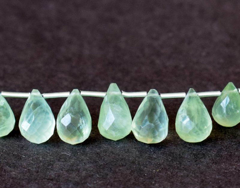 PREHNITE - BRIOLETTE 6X8 mm - TASSEL: " TASSEL"- means the drilled pieces of gemstones are loosely attached with a wire , ideally you can use it to create of of a kind jewelry . STONE : NATURAL EARTH MINED PREHNITE FACETED BRIOLETTE SHAPE