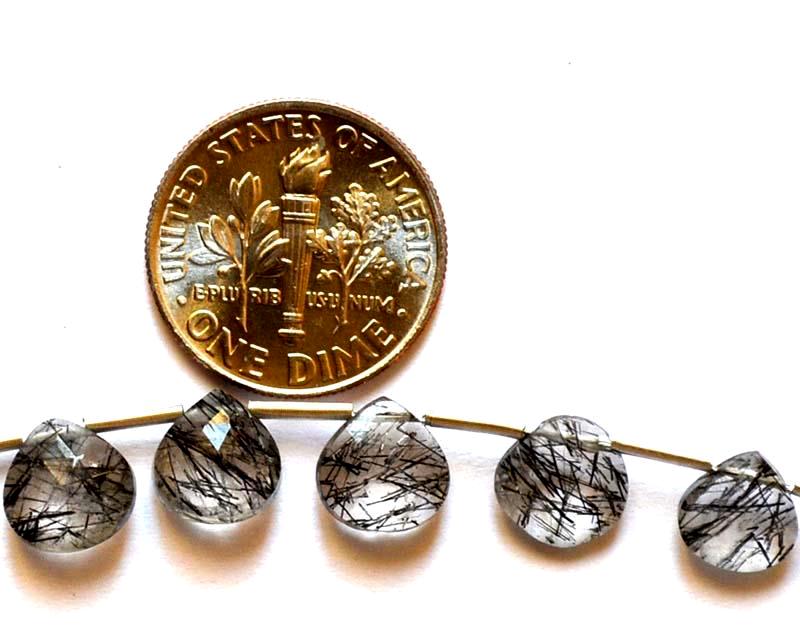 BLACK RUTILE QUARTZ - HEARTS 7 - 7.5 mm - TASSEL: " TASSEL"- means the drilled pieces of gemstones are loosely attached with a wire , ideally you can use it to create of of a kind jewelry . STONE : NATURAL EARTH MINED FINE BLACK RUTILE QUARTZ HEART S